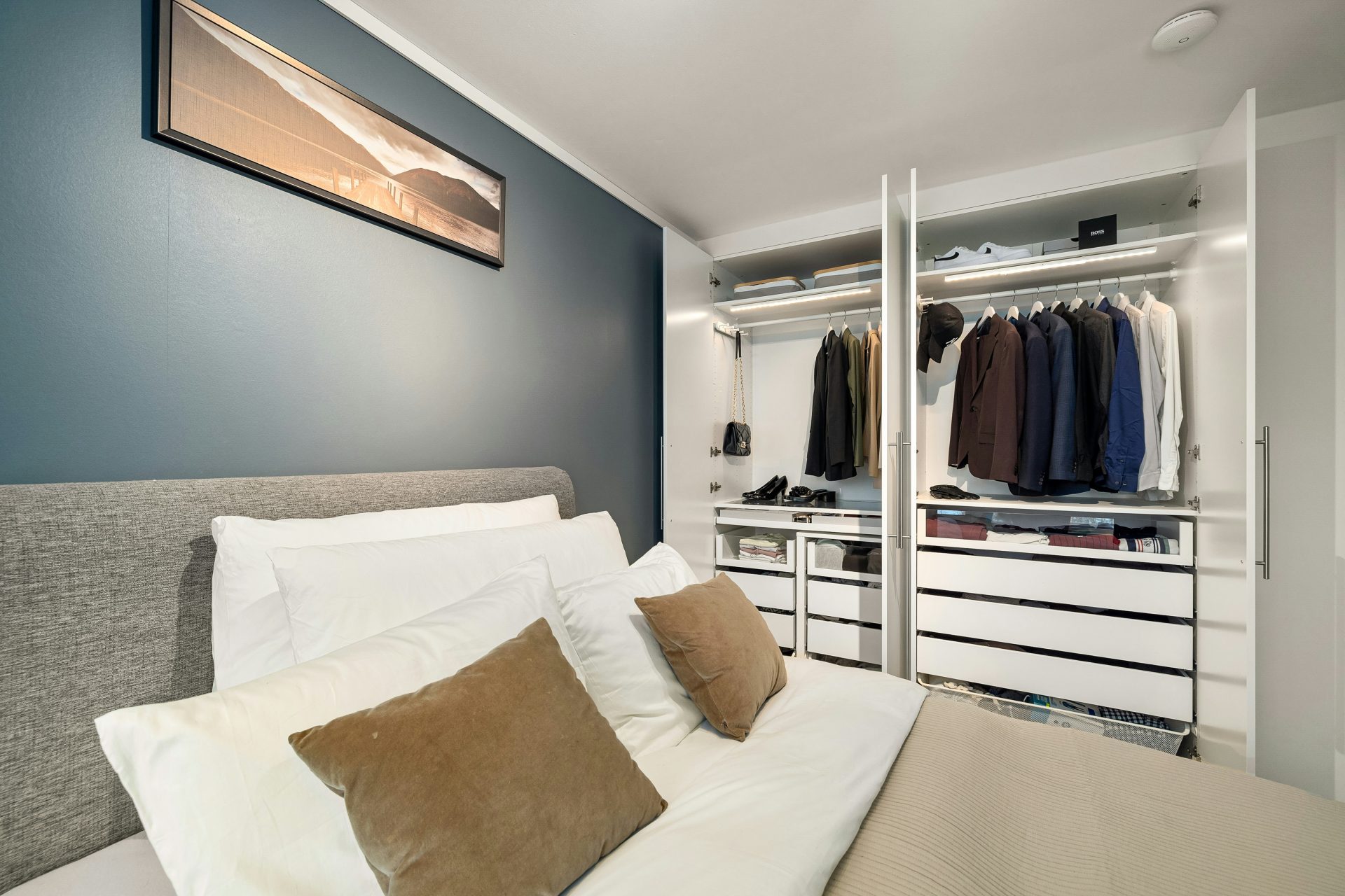 A bed sitting in a bedroom next to a closet